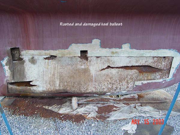 Keel damage – rusted scrap metal added for weight in encapsulated concrete ballast.